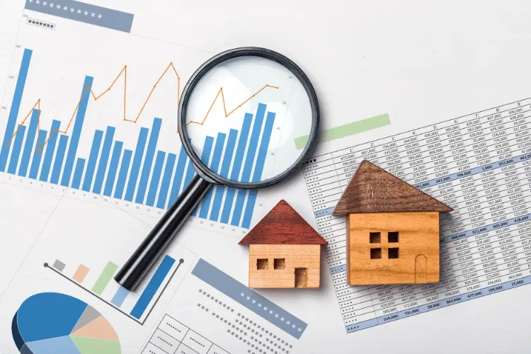 Real estate analysis reports and magnifying glass showing investment concept Is Caltier Legit?